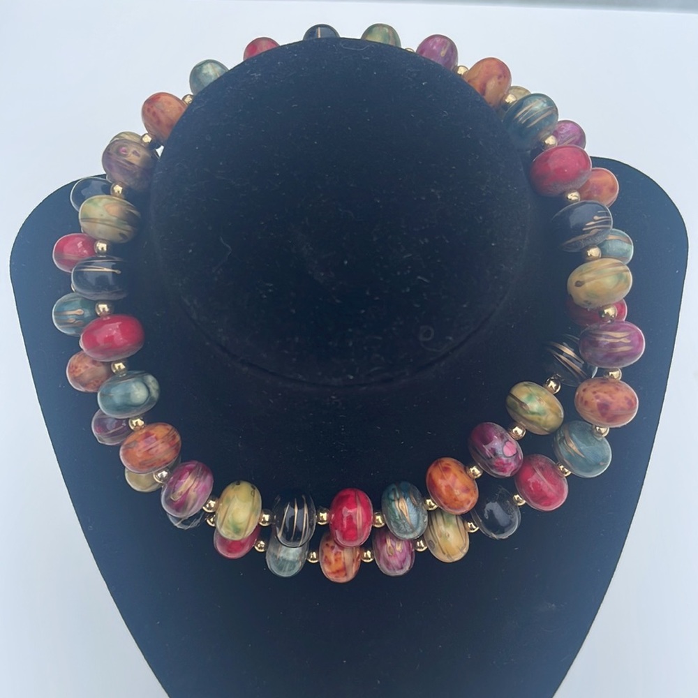 Vintage multi colored beads drizzled gold paint 28”